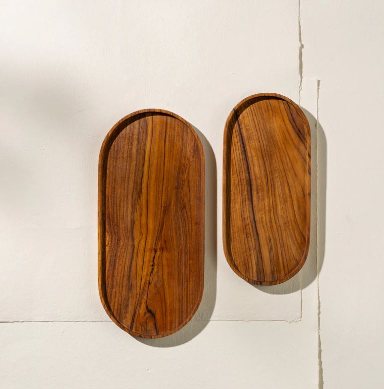 Two wooden trays on a light-colored surface