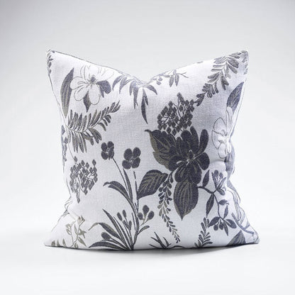 Indulge in comfort and luxury with the Chelsea Reversible Floral Grey & Charcoal Cotton Cushion. Made with 100% cotton jacquard, this cushion boasts a soft and inviting texture. Adorned with intricate floral designs on both sides, it showcases a stunning contrast of ivory and slate tones. Complete with our exclusive plump feather insert, this cushion is the epitome of indulgence and luxury.