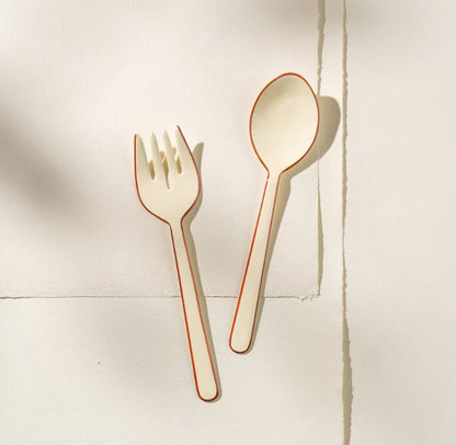 Bring understated elegance to your table with these exquisite handcrafted salad servers from India. Constructed from robust stainless steel and adorned with a refined enamel finish, these servers combine practicality with aesthetic appeal. Perfect for those who believe serving should be as memorable as the meal itself, this set adds a touch of artisanal charm to every dining occasion. Hand-wash to preserve the beautiful craftsmanship that makes these pieces truly special.