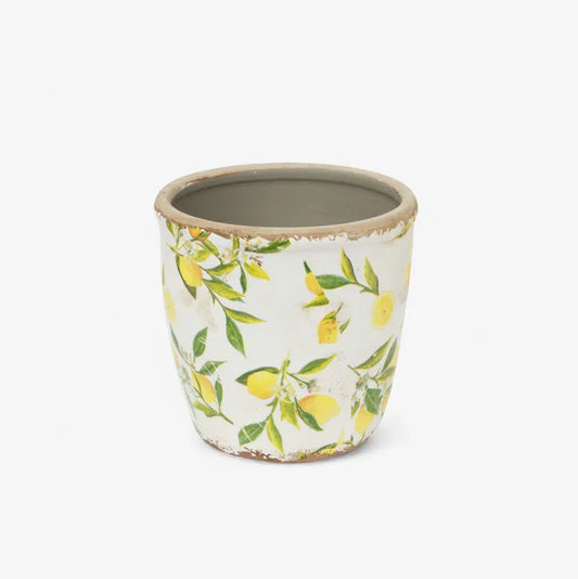 Ceramic pot with lemon pattern on a white background