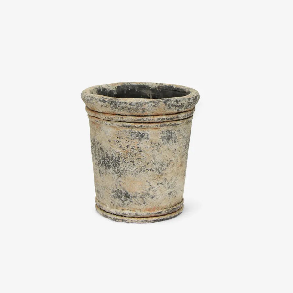 Small terracotta pot on a white background