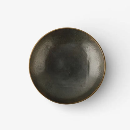 Dark metal bowl on a white background