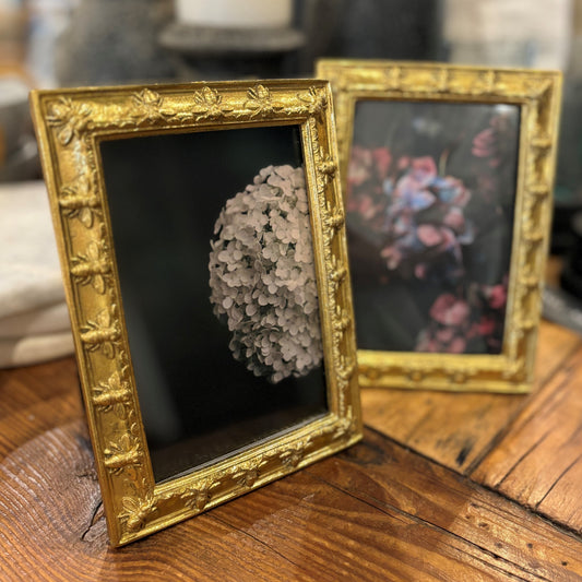 Display photos with style with the Bumble Bee Photo Frame. Adorned with a French bee motif, symbolic of Napoleon's empire, this charming yet regal frame is a beautiful way to show off your favorite photos. Perfect for adding a touch of sophistication to any room. Front