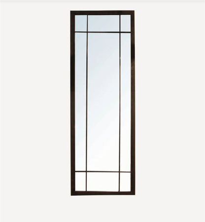 A tall rectangular wall mirror with a dark brown frame and geometric glass panes, shown against a plain light gray background.