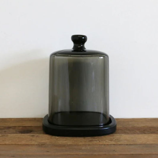 Perfect for displaying luxury candles, this smoke glass dome with black base protects fragrance while adding understated, stylish elegance to your home.