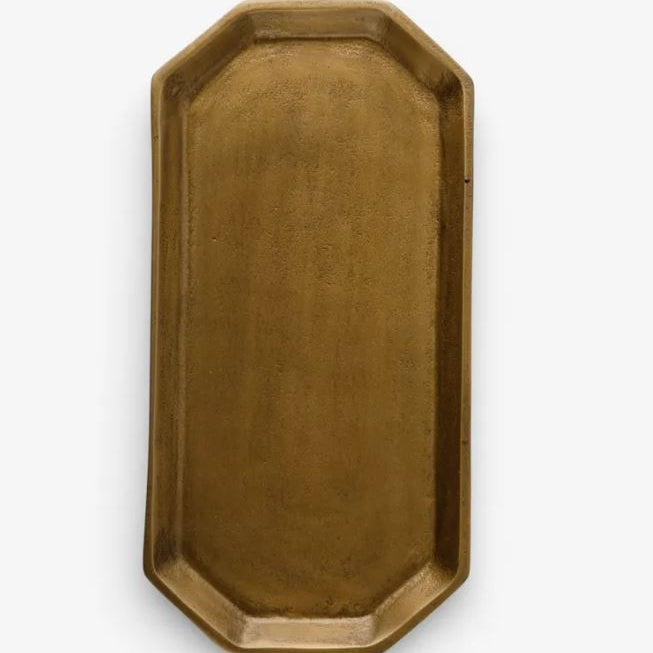 Gold metal tray on a white background