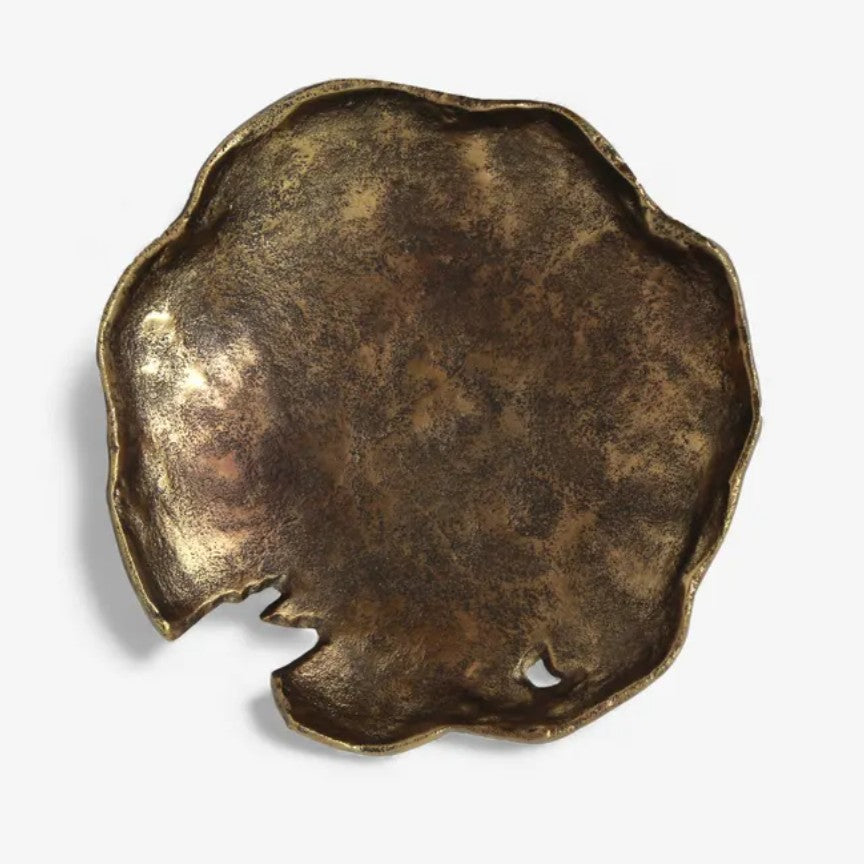 Bronze-colored decorative object on a white background