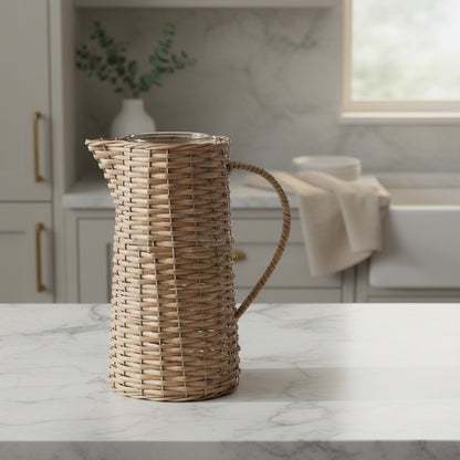 A woven natural fiber pitcher with a curved handle and a clear glass top, shown on a light gray background with a 'BEST SELLER' label in the top-left corner.