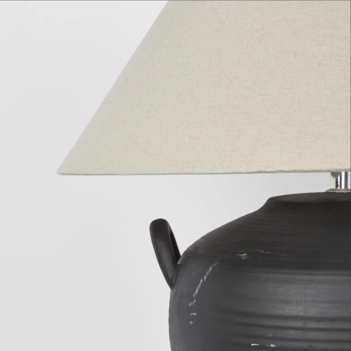 Experience the versatile charm of the Camille Black Table Lamp &amp; Shade, expertly crafted from ceramics. Perfect for any setting, this piece will add a touch of elegance and functionality to your space.

Dimensions: L 46cm W 46cm H 48cm&nbsp;