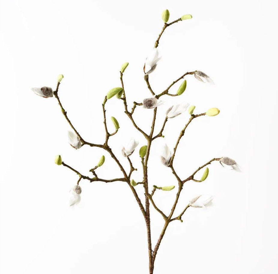 Artificial flower branch with white flowers and green buds on a white background