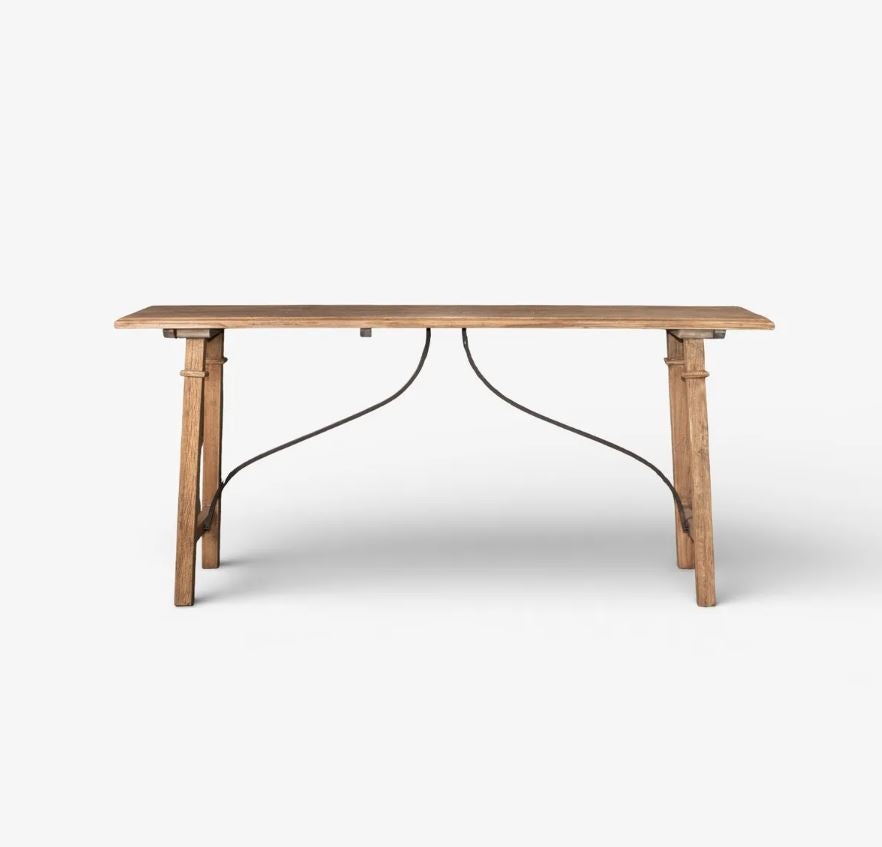 A rustic wooden dining table with a natural oak finish and a black metal wire frame support, shown against a plain white background.