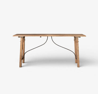 A rustic wooden dining table with a natural oak finish and a black metal wire frame support, shown against a plain white background.