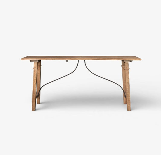 A rustic wooden dining table with a natural oak finish and a black metal wire frame support, shown against a plain white background.