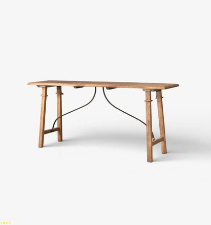 A rustic wooden writing desk with a light brown wood grain finish and a dark metal wire frame support structure underneath, shown on a clean white background.