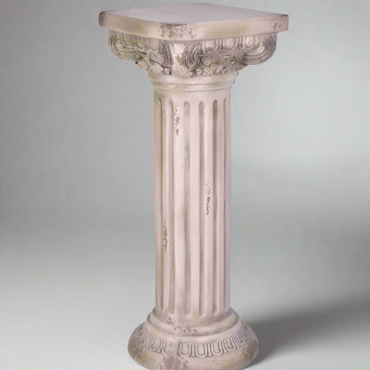 Decorative column-style pedestal on a white background
