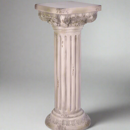 Decorative column-style pedestal on a white background