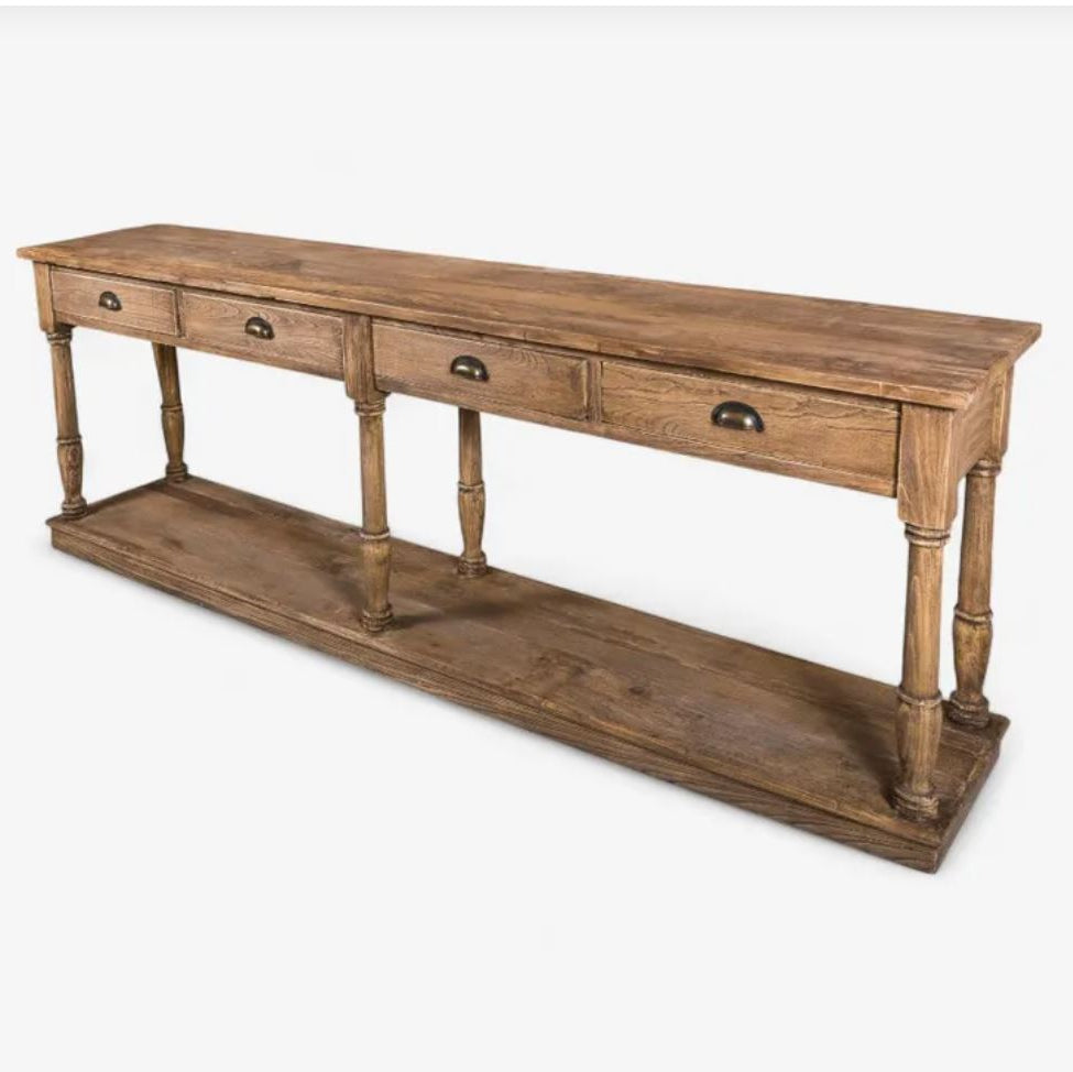 A rustic brown wooden console table with three drawers on the top, turned legs, and a lower open shelf, shown on a light gray background.