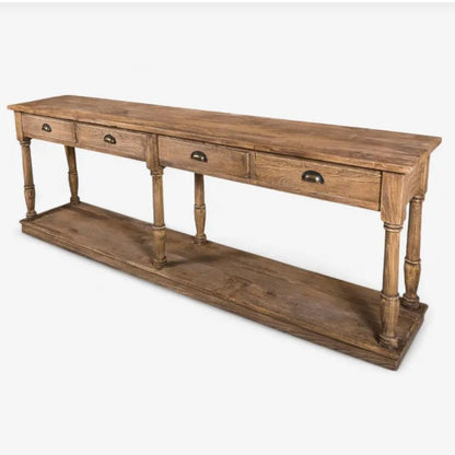 A rustic brown wooden console table with three drawers on the top, turned legs, and a lower open shelf, shown on a light gray background.