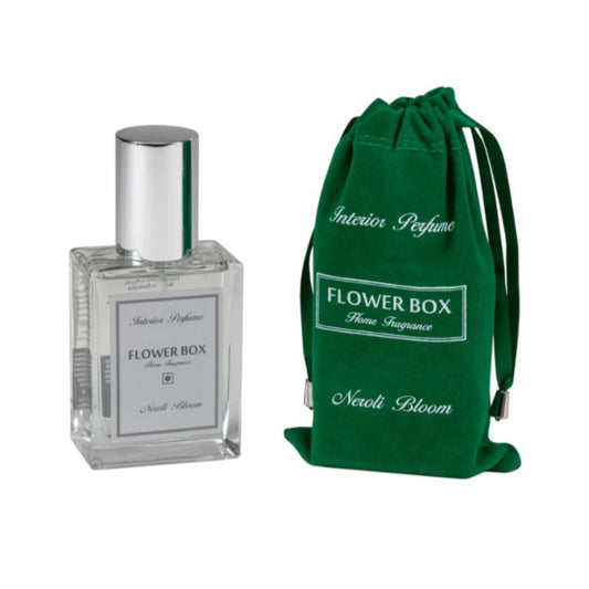 Flower Box perfume bottle with green drawstring bag on a white background