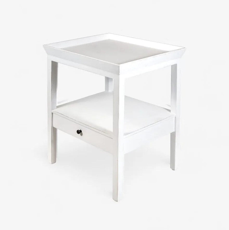White side table with a drawer on a white background