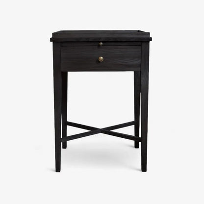 Black side table with a drawer on a white background