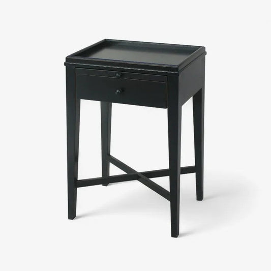 Black side table with a drawer on a white background