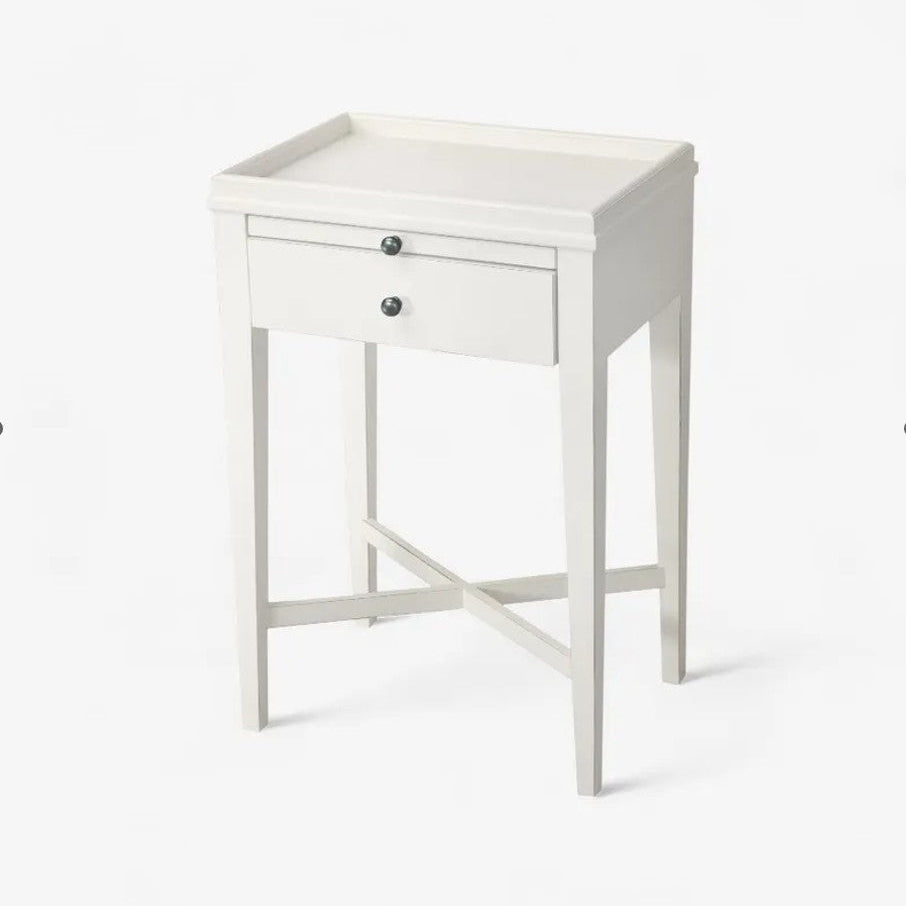 White side table with a drawer on a white background