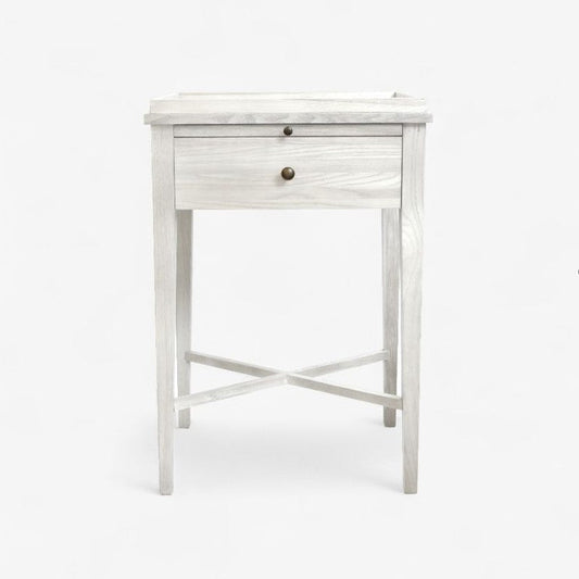 White wooden side table with a drawer on a white background