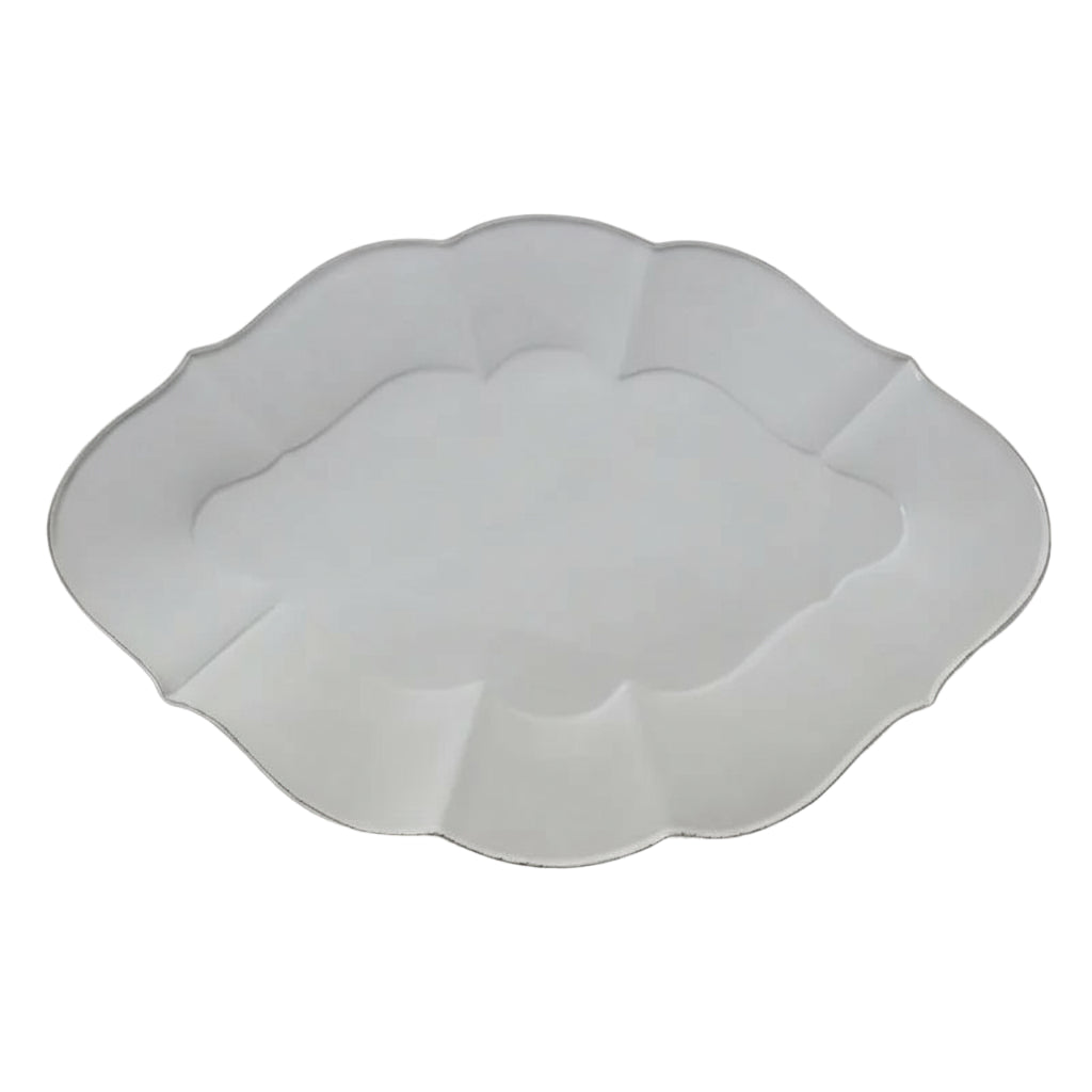 Elevate your dining experience with the Vienna Stoneware Oval Platter, featuring a timeless scalloped design that adds a touch of elegance to every meal. Crafted for durability and style, this plate brings a refined, formal atmosphere to your table, perfect for both special occasions and everyday sophistication.
