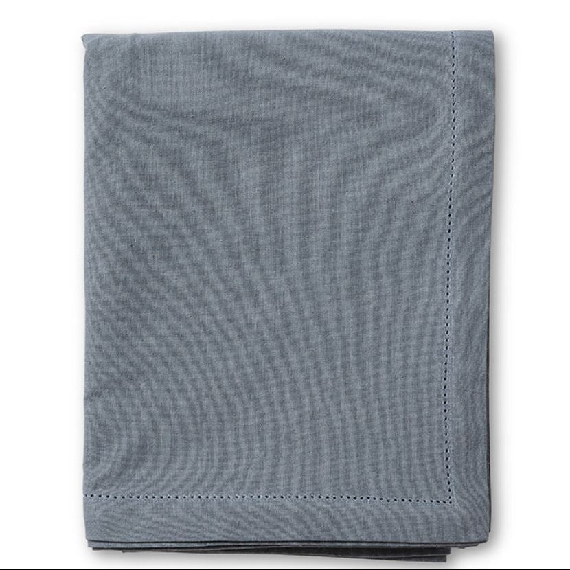 Folded blue textured fabric on a white background