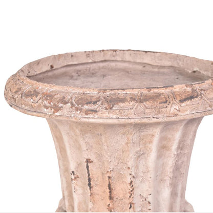 Terracotta pot with a textured surface on a white background