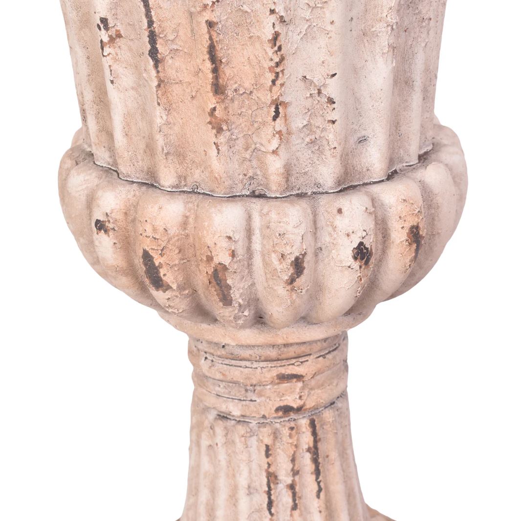 Decorative column capital with intricate detailing on a white background