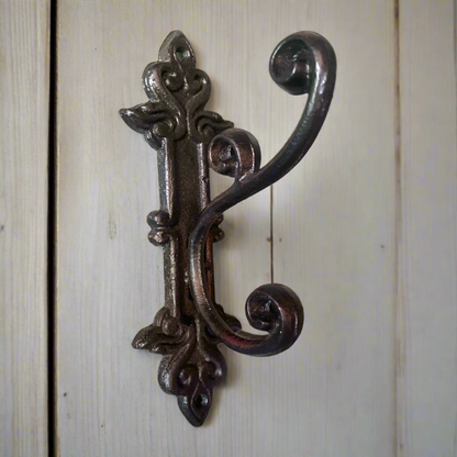 This charming & timeless cast iron hook is perfect in anywhere in the house for additional hanging. 