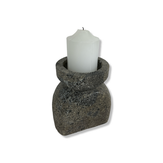 Experience the captivating soft glow of the Bari Black Laval Stone Candle Holder, the perfect balance of strength and grace. Illuminate any space with this elegant yet sturdy piece, creating a tranquil atmosphere that soothes the senses. Styled.