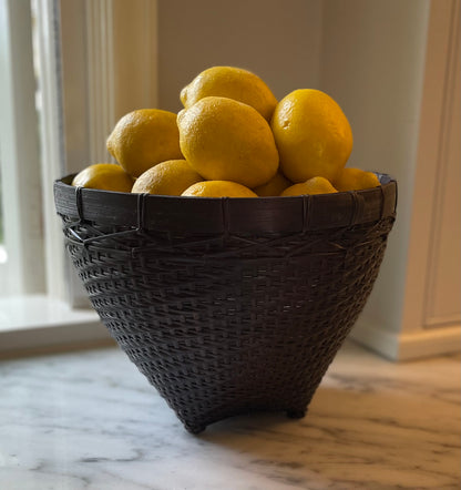 Our Banyu Handwoven Bamboo & Rattan Basket is crafted in East Indonesian Island Villages. These striking baskets can be used as an accent piece or to provide additional useful storage. Styled.