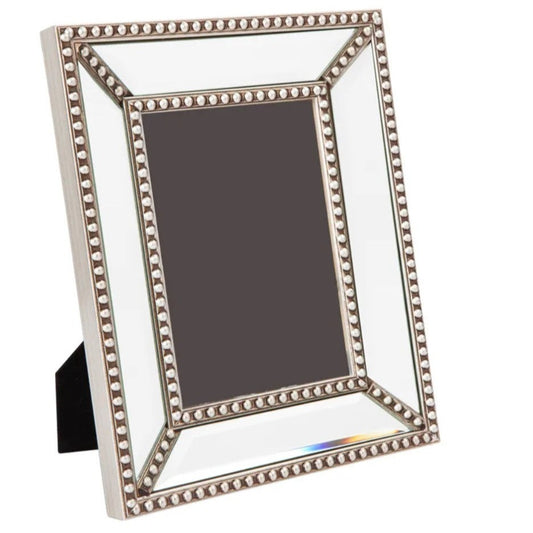 This classic mirrored frame with exquisite antique silver bead detailing is a great way to display your memories. The versatile design fits a 5 x 7” photo and can be positioned horizontally or vertically for ultimate versatility. Front