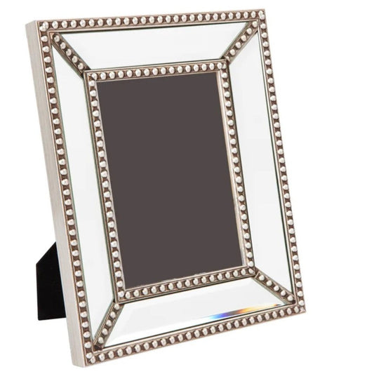 This classic mirrored frame with exquisite antique silver bead detailing is a great way to display your memories. The versatile design fits a 8x10” photo and can be positioned horizontally or vertically for ultimate versatility. Front
