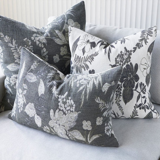 The Chelsea Reversible Floral Cotton Cushion is a luxurious addition to any room. Crafted with 100% cotton jacquard, its soft texture makes it irresistibly comfortable. Featuring intricate floral patterns on both sides, this reversible cushion offers an eye-catching display of contrasting ivory and slate tones. Styled.