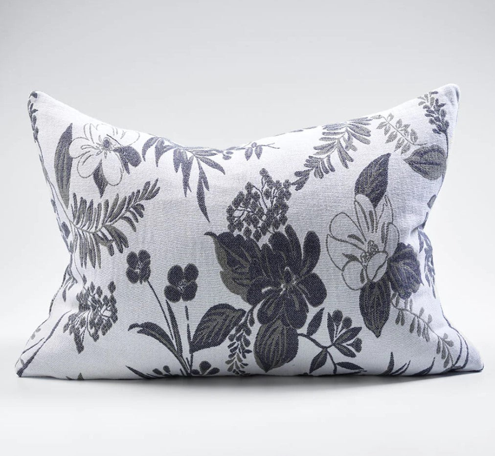 The Chelsea Reversible Floral Lumbar Cushion is a luxurious addition to any room. Crafted with 100% cotton jacquard, its soft texture makes it irresistibly comfortable. Featuring intricate floral patterns on both sides, this reversible cushion offers an eye-catching display of contrasting ivory and slate tones. Expertly filled with our exclusive plump feather insert, this cushion offers a truly sumptuous feel.