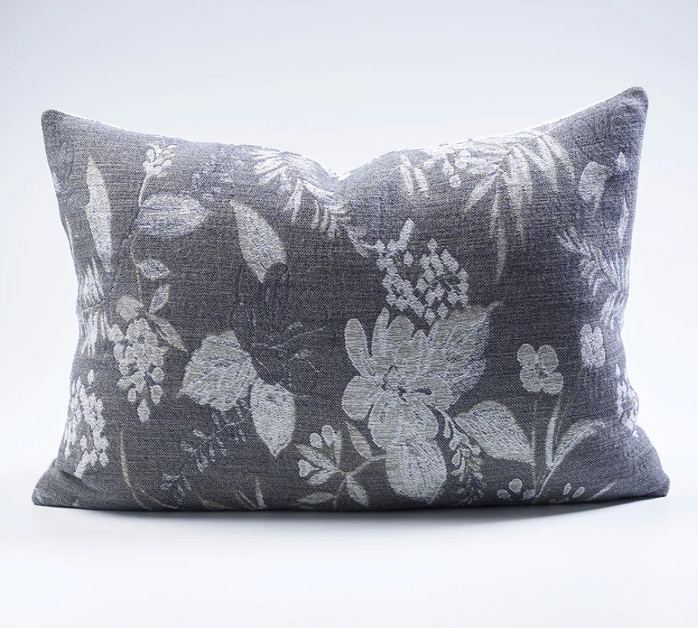 The Chelsea Reversible Floral Lumbar Cushion is a luxurious addition to any room. Crafted with 100% cotton jacquard, its soft texture makes it irresistibly comfortable. Featuring intricate floral patterns on both sides, this reversible cushion offers an eye-catching display of contrasting ivory and slate tones. Expertly filled with our exclusive plump feather insert, this cushion offers a truly sumptuous feel. Reverse