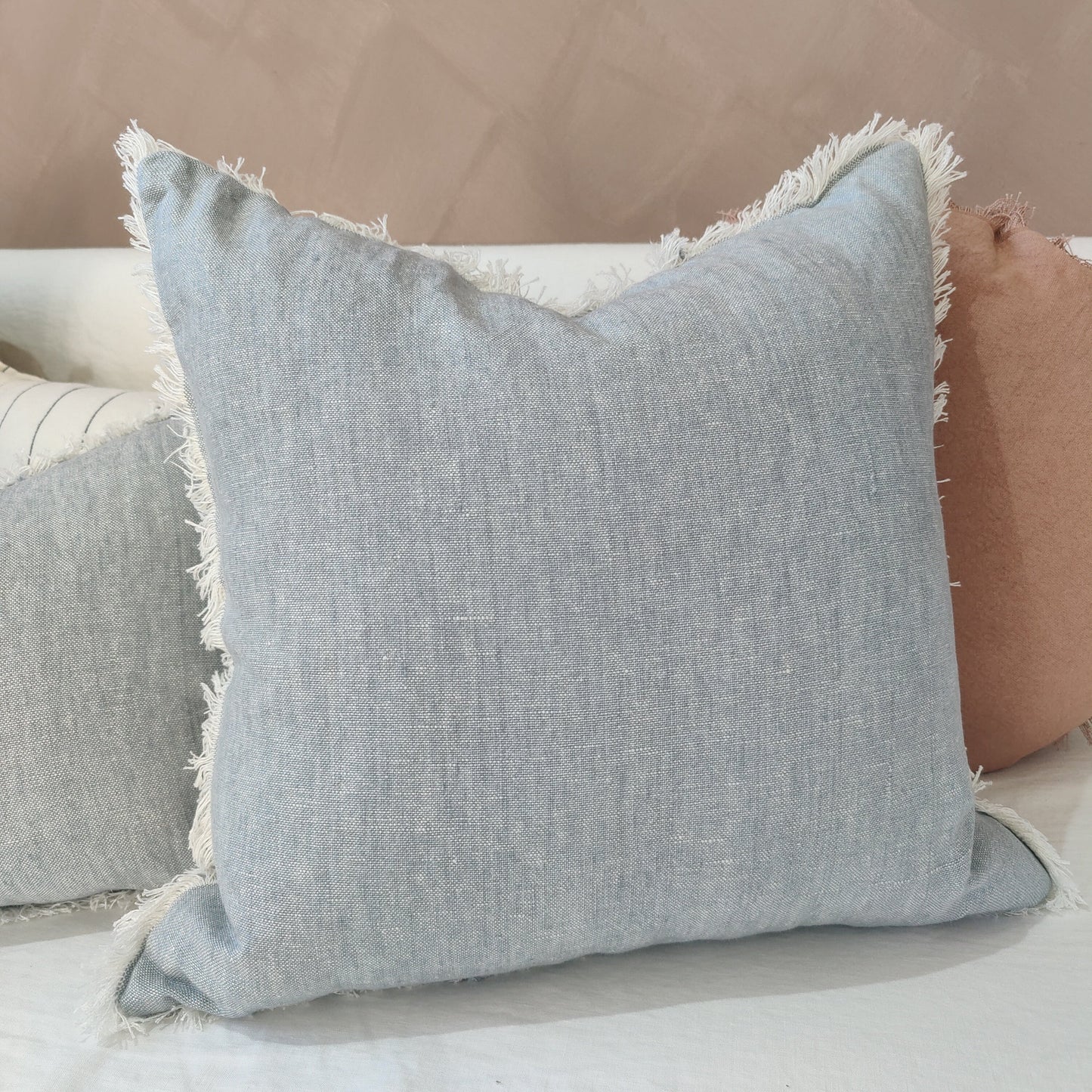 Experience the exquisite beauty and versatility of the Glacier Lake Blue Pure French Linen Cushion. Its subtle, stone washed hue effortlessly complements any interior and creates a stunning effect when paired with other textiles.