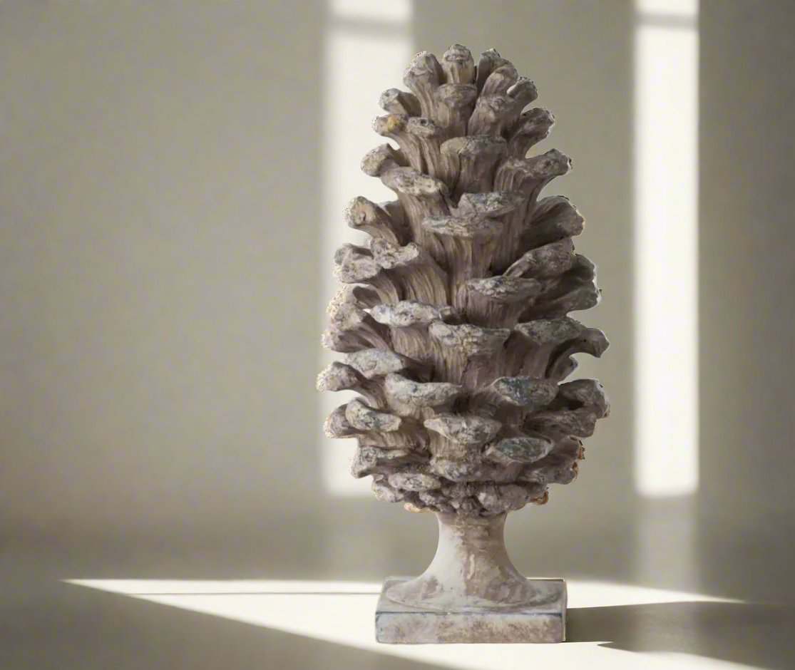 Transform any room into a cozy haven with this stunningly detailed Decorative Pine Cone . This versatile ornament boasts a soft grey taupe colour with a beautiful distressed, aged look that will complement any side table, console, bookcase, or mantle.