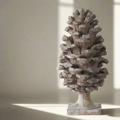 Transform any room into a cozy haven with this stunningly detailed Decorative Pine Cone . This versatile ornament boasts a soft grey taupe colour with a beautiful distressed, aged look that will complement any side table, console, bookcase, or mantle.