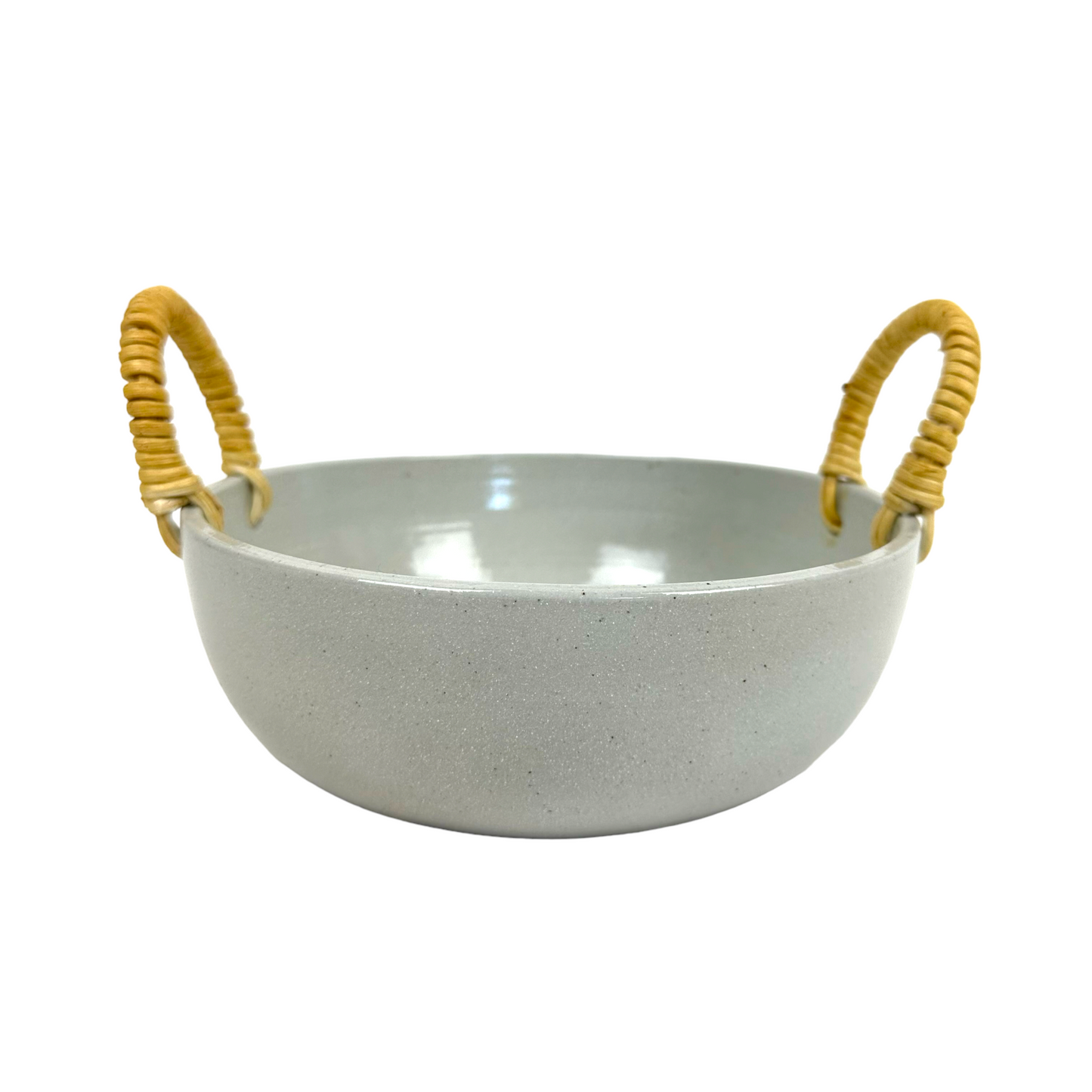 Our Rimbah Ceramic Rattan Bowl is a beautifully handmade, tactile piece, with qualities that are evident in its organic shape and distinctive glazed finish. The subtle cream stoneware accented by Rattan handles brings a stylish aesthetic to your table.