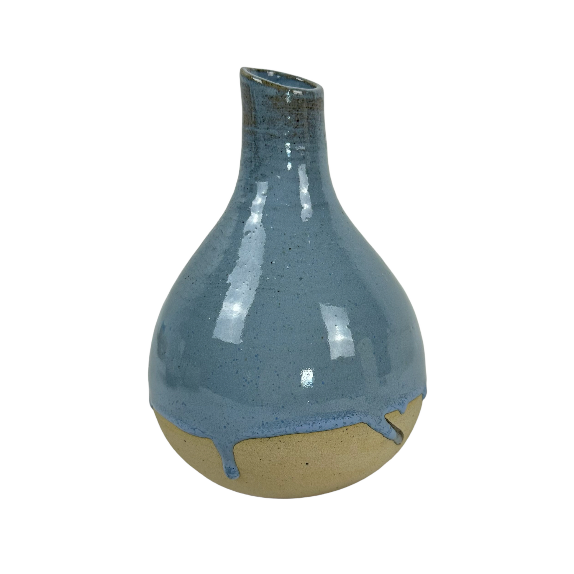 Indulge in the exquisite craftsmanship of Indonesian artisans with the Okta Handcarved Blue Ceramic Vase. Its stunning sky blue glaze beautifully complements the raw, unglazed base for a truly captivating piece.