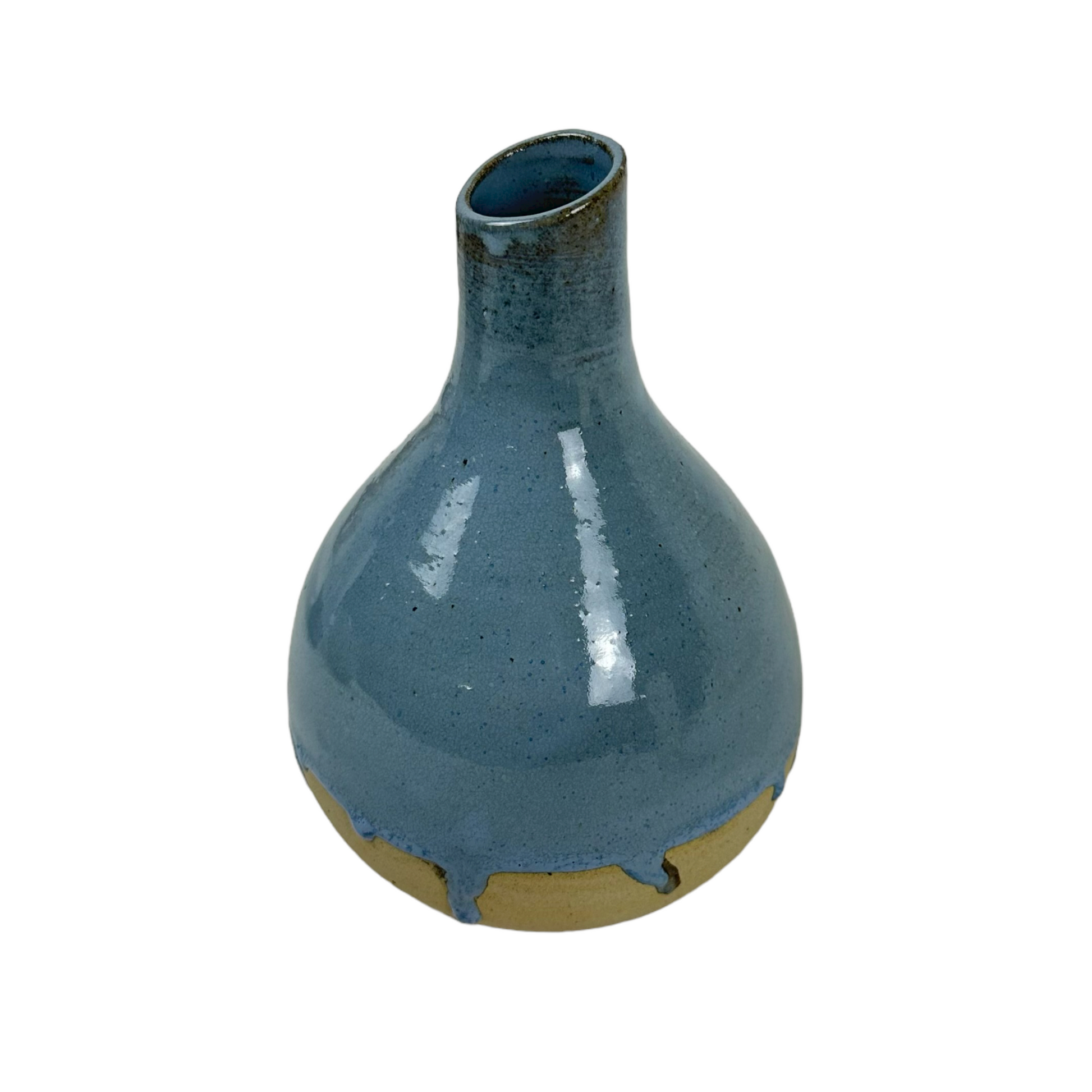 Indulge in the exquisite craftsmanship of Indonesian artisans with the Okta Handcarved Blue Ceramic Vase. Its stunning sky blue glaze beautifully complements the raw, unglazed base for a truly captivating piece. Front.