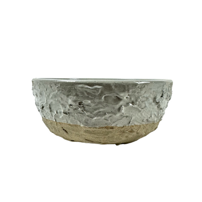 The Handcrafted Textured Enzo Bowl features calming neutral tones providing an attractive design that elevates the everyday to something unique and stylish.