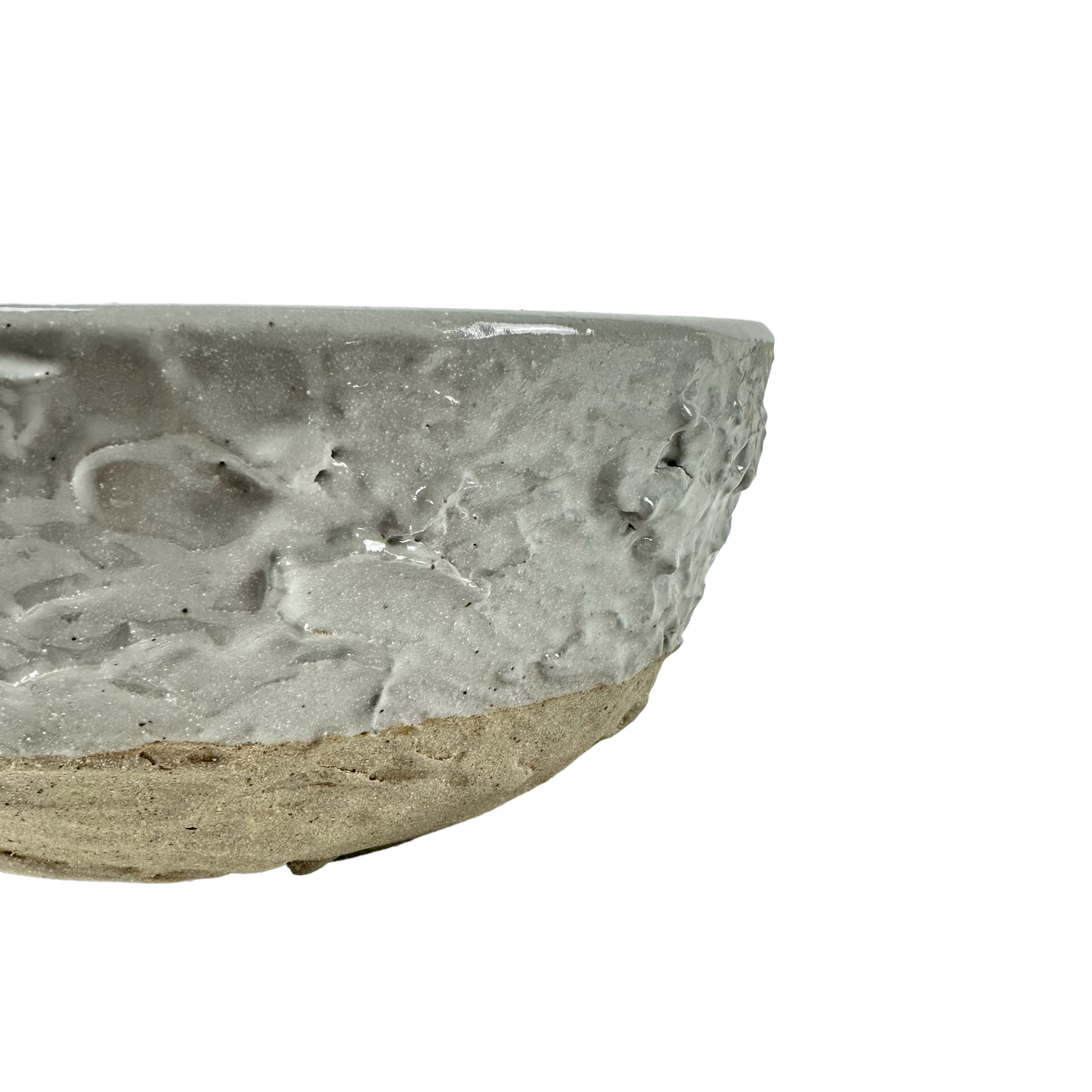 The Handcrafted Textured Enzo Bowl features calming neutral tones providing an attractive design that elevates the everyday to something unique and stylish. Detail.