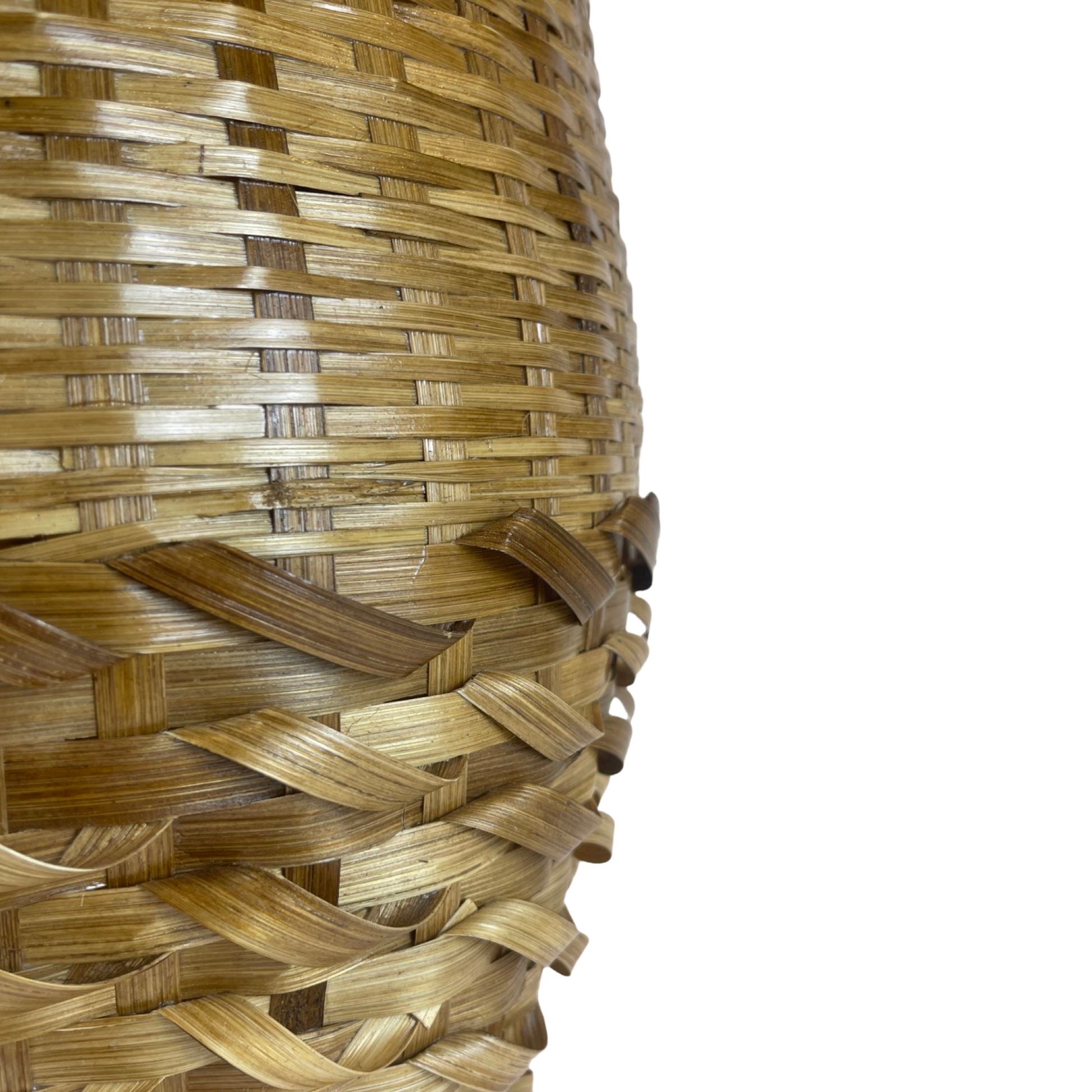 The attractive yet functional Fitri Handcrafted Bamboo Basket with handles is made in the South East Asia Islands in a design handed down from generation to generation. Detail close up.