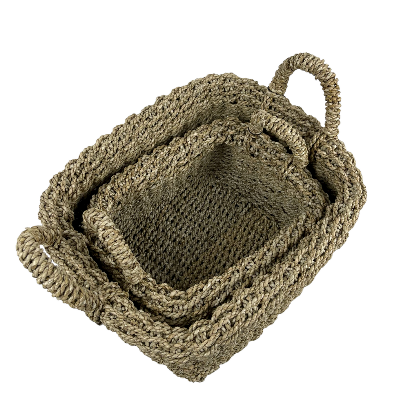 Tightly handwoven from seagrass, our Saudari Seagrass Baskets feature sturdy handles which add charm and understated style. Use to display indoor plants or for a wide range of storage options. Stacked styled.